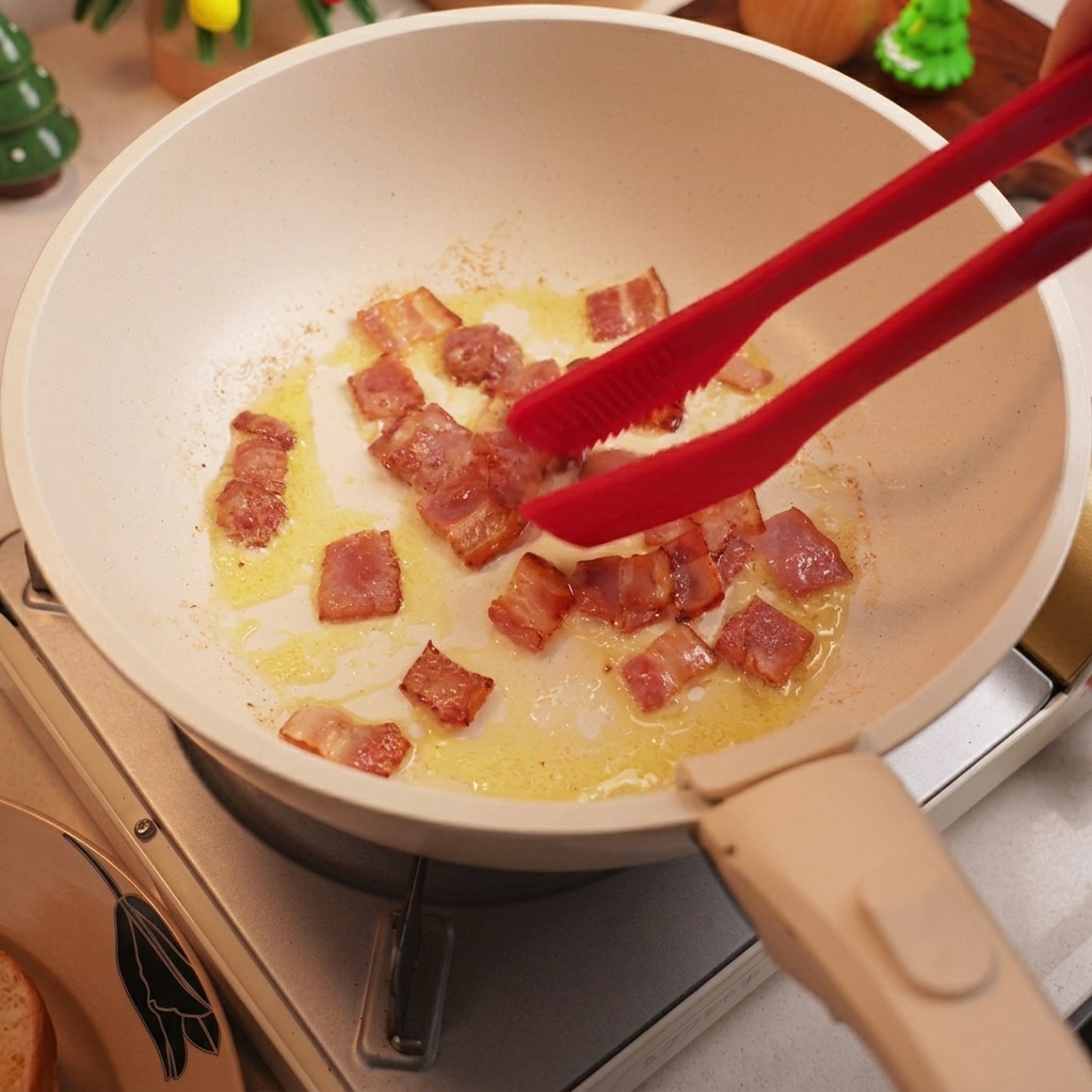 Lardons coupés en dés rissolant dans une poêle jusquà devenir dorés et croustillants.